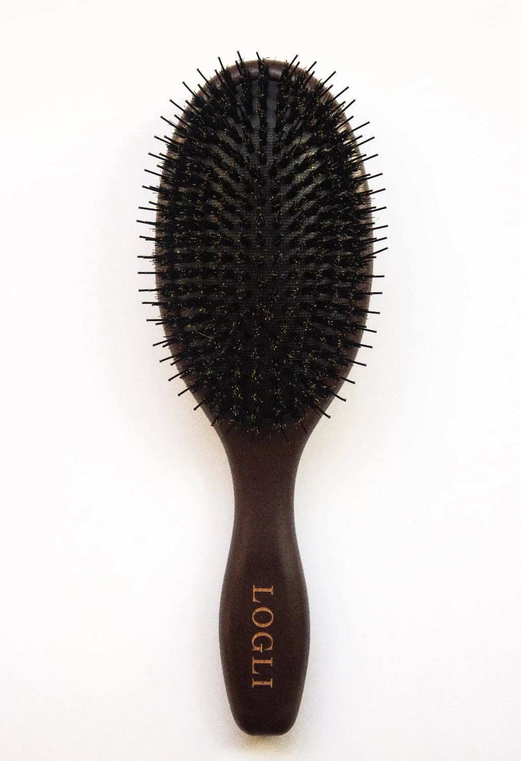 Burgundy hairbrush with bristles on a light gray background