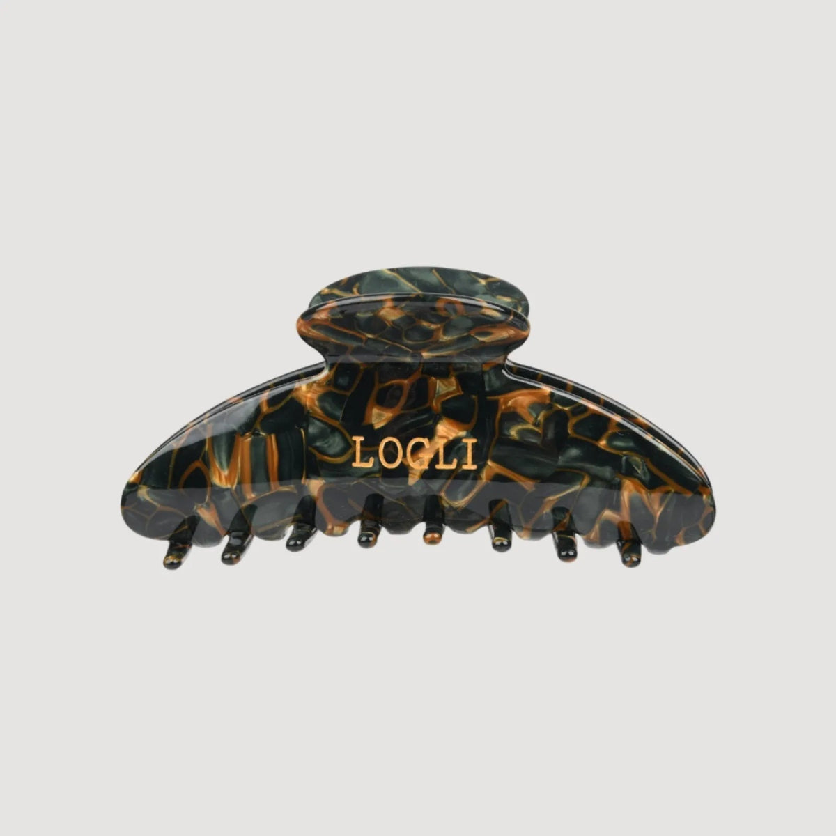 Tortoiseshell patterned hair clip with 'LOGLI' branding on a light gray background