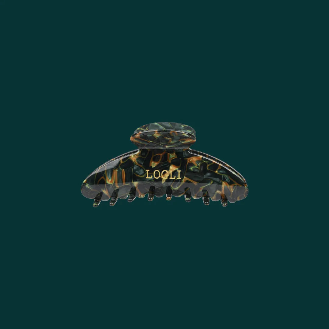 Tortoiseshell patterned hair clip with 'LOOLI' branding on a dark green background