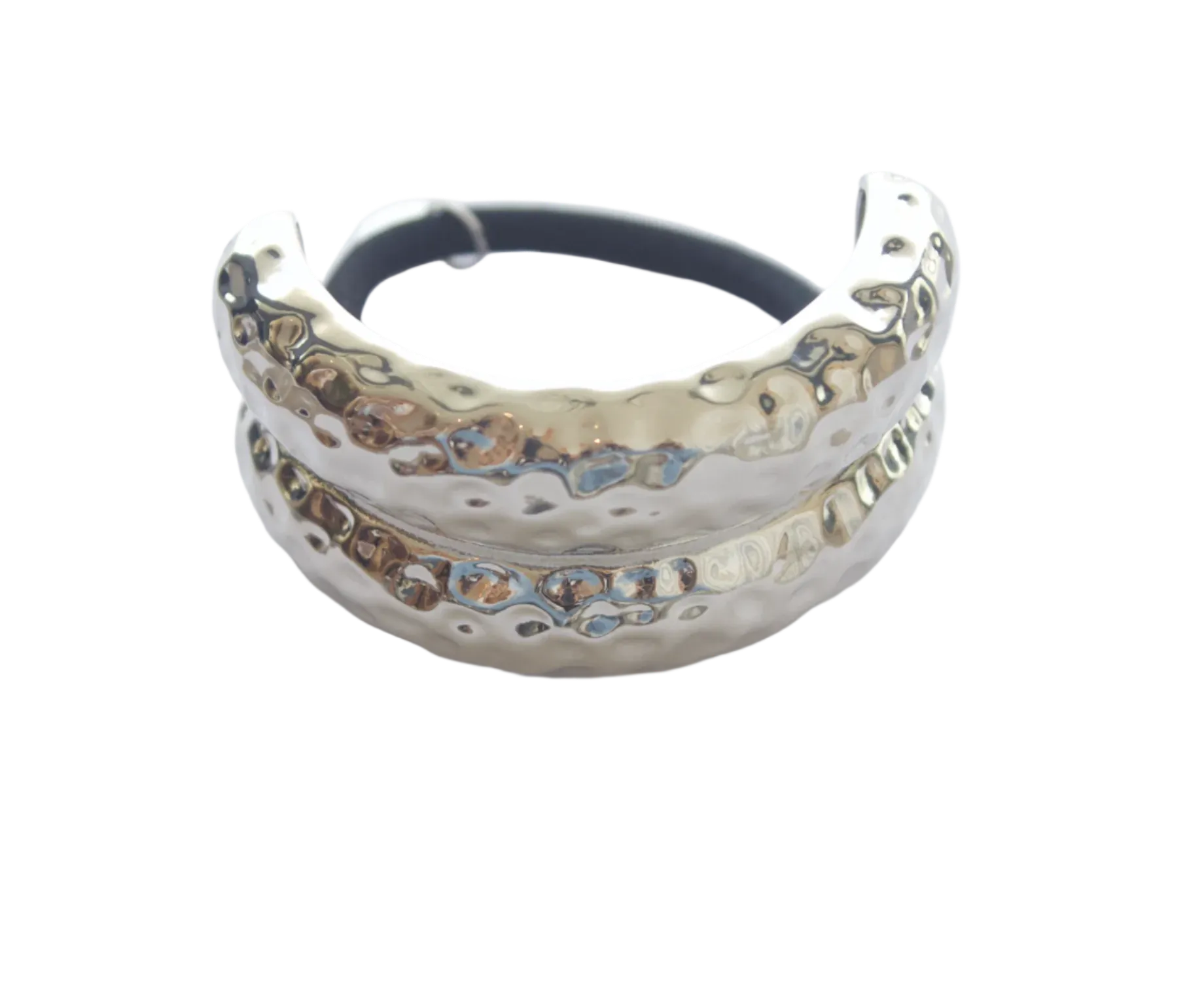 Silver metal hairband with textured design on a light gray background