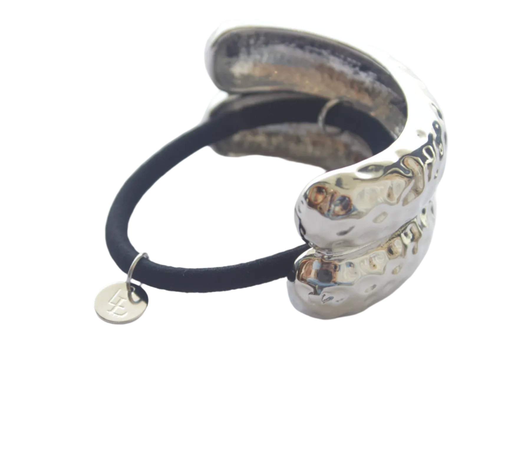 Silver hair tie with black elastic on a white background