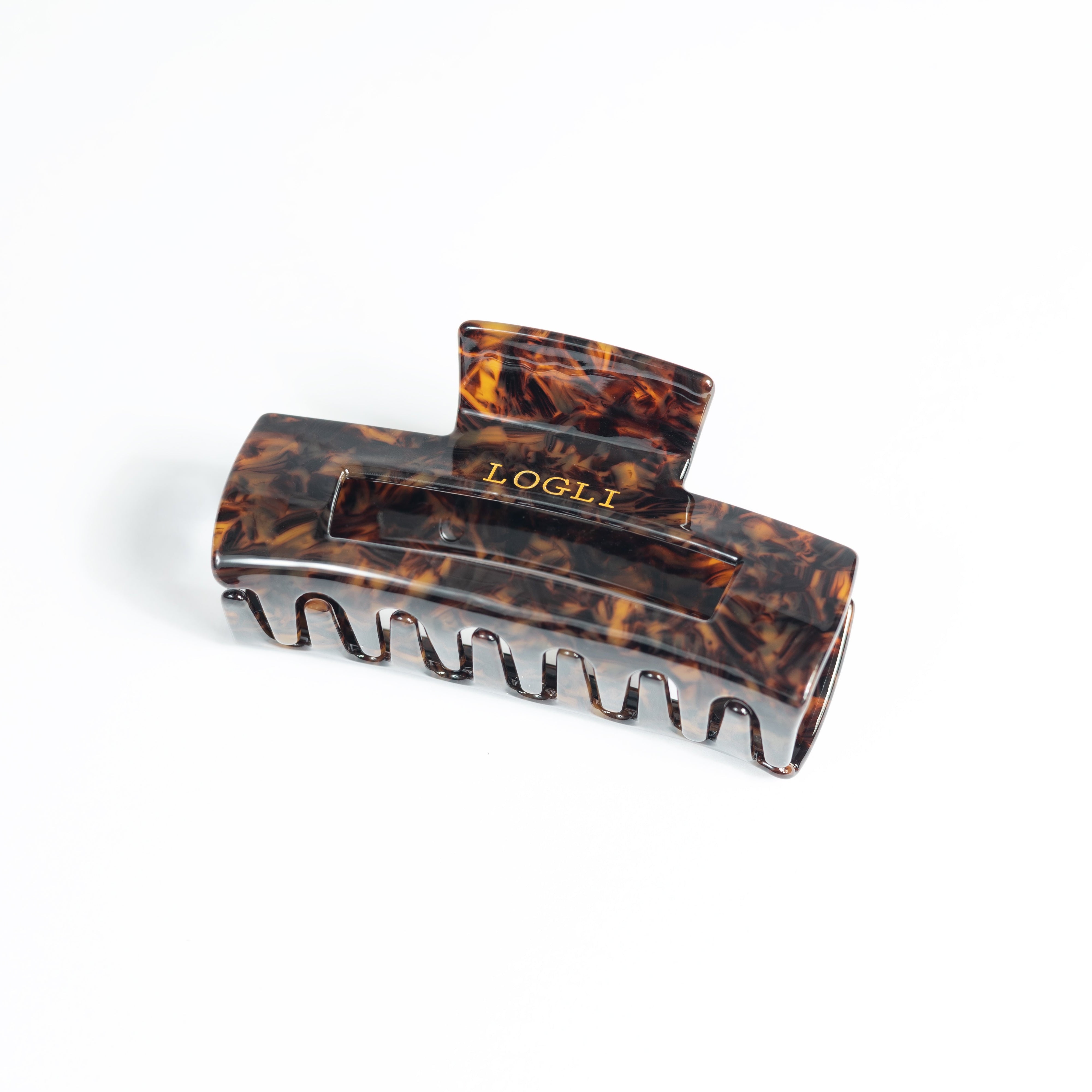 Tortoiseshell hair clip on a white background