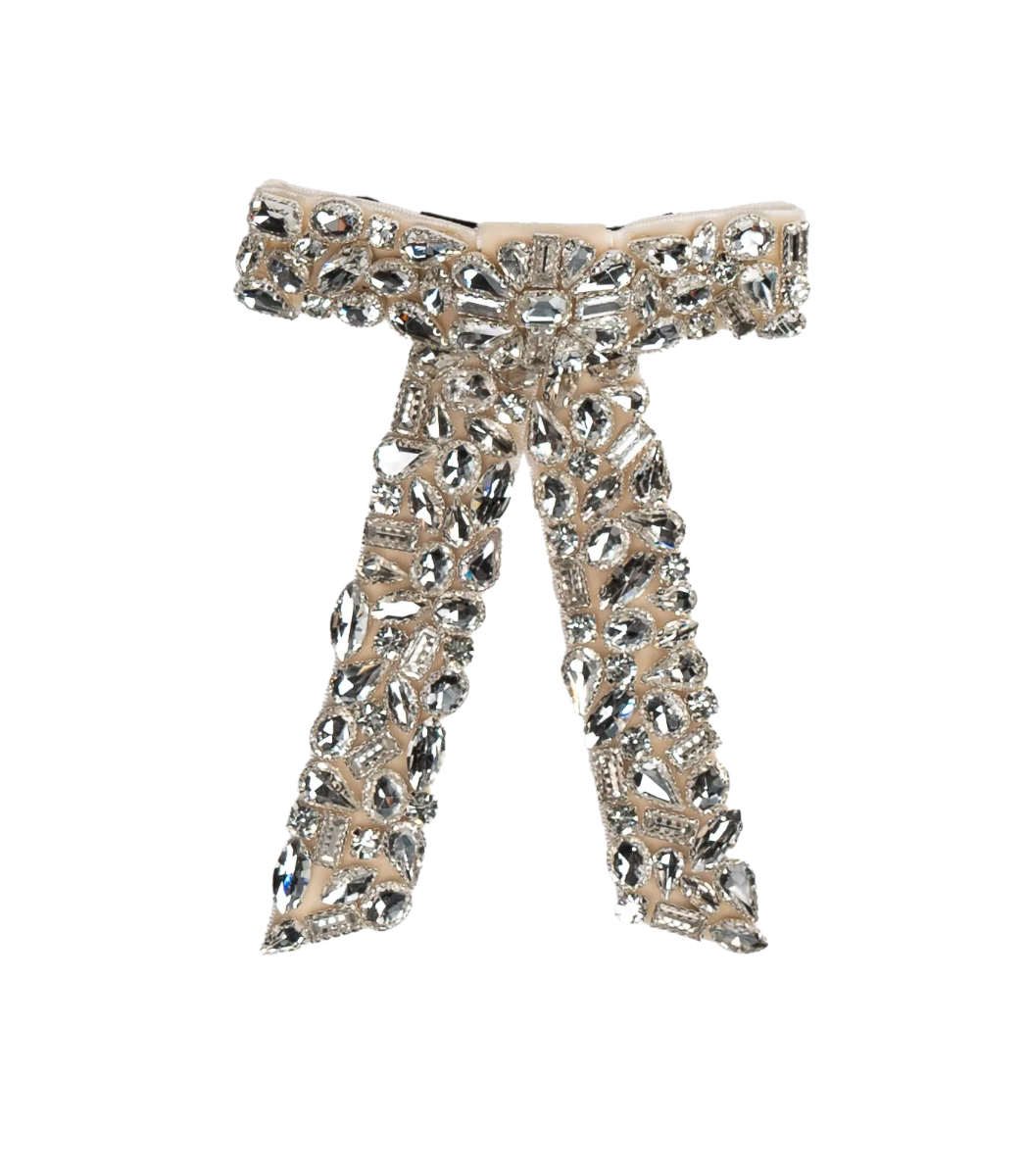 Decorative brooch with intricate design on a white background