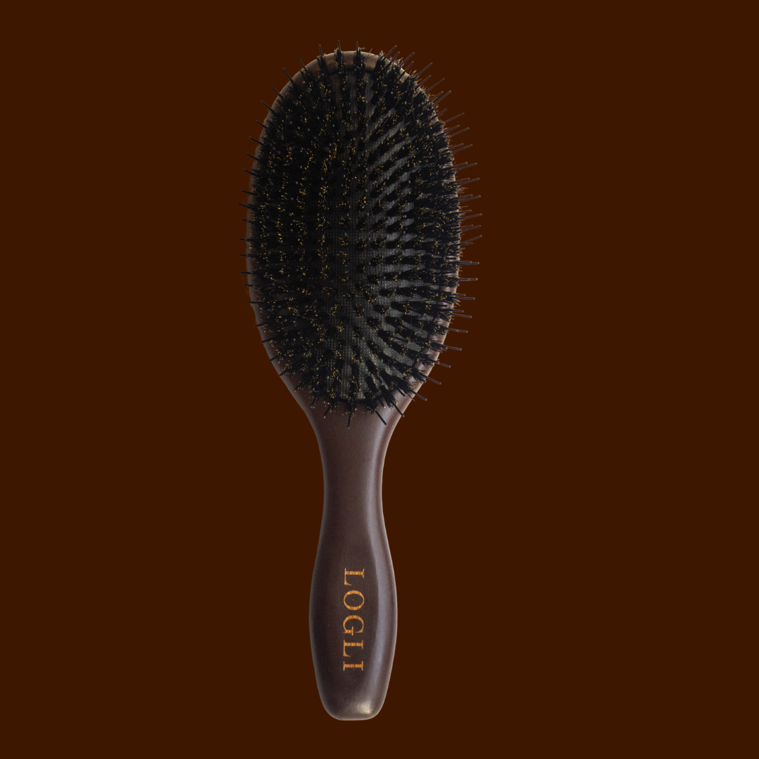 Burgundy hairbrush with 'LOGLI' branding on a dark brown background