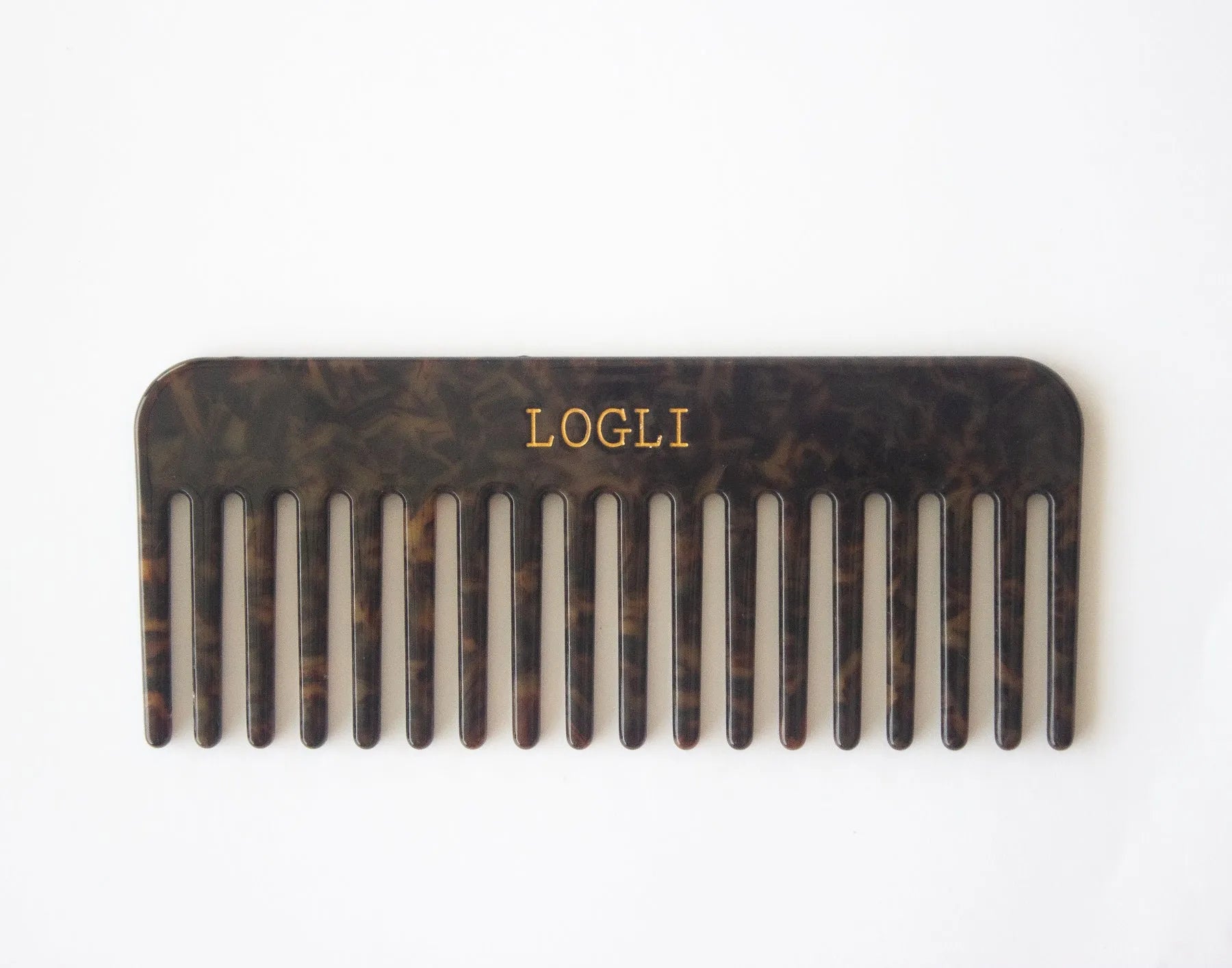 Tortoiseshell comb with 'LOGLI' branding on a white background