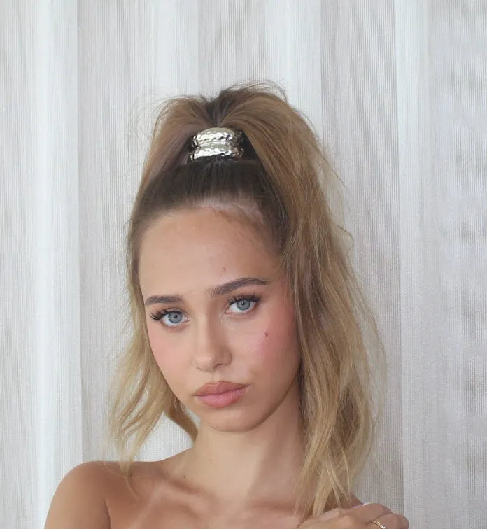 Woman with high ponytail with cuff